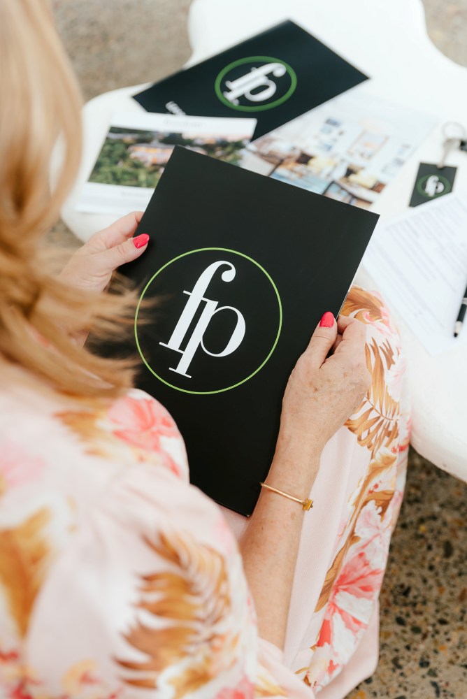 Brisbane Branding Photographer agent holding property folder