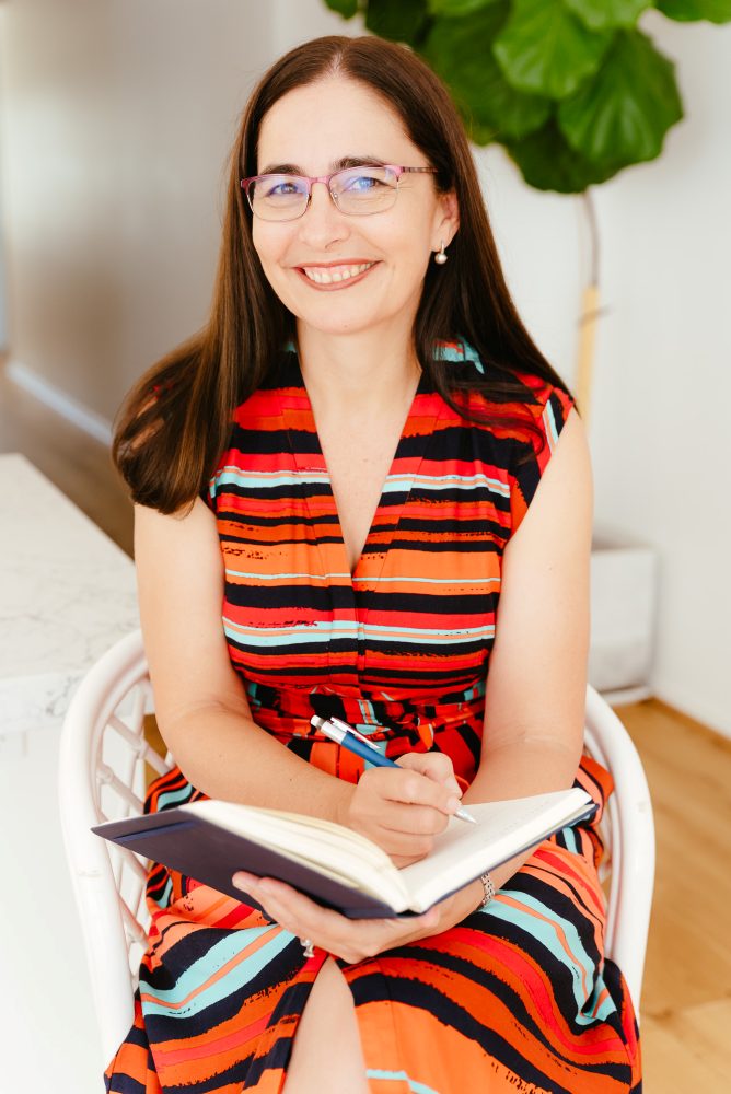 Brisbane Branding Photographer Kylie Hayes Coach writing in notebook