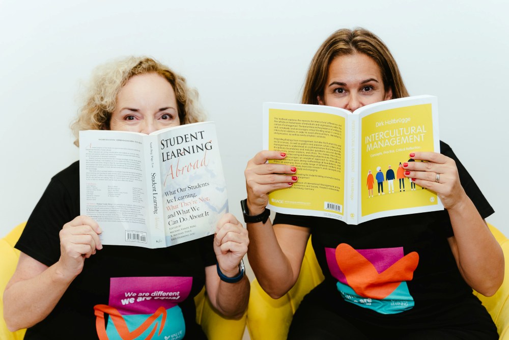 Brisbane Branding Photography Fran and Marcela holding learning books