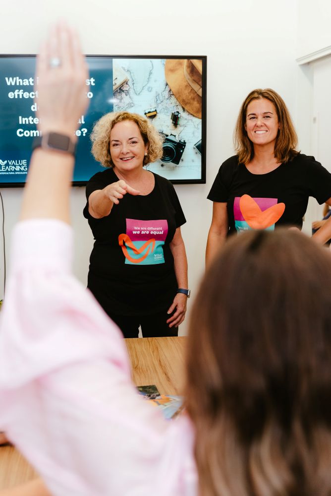 Brisbane Branding Photography teachers answering student with raised hand