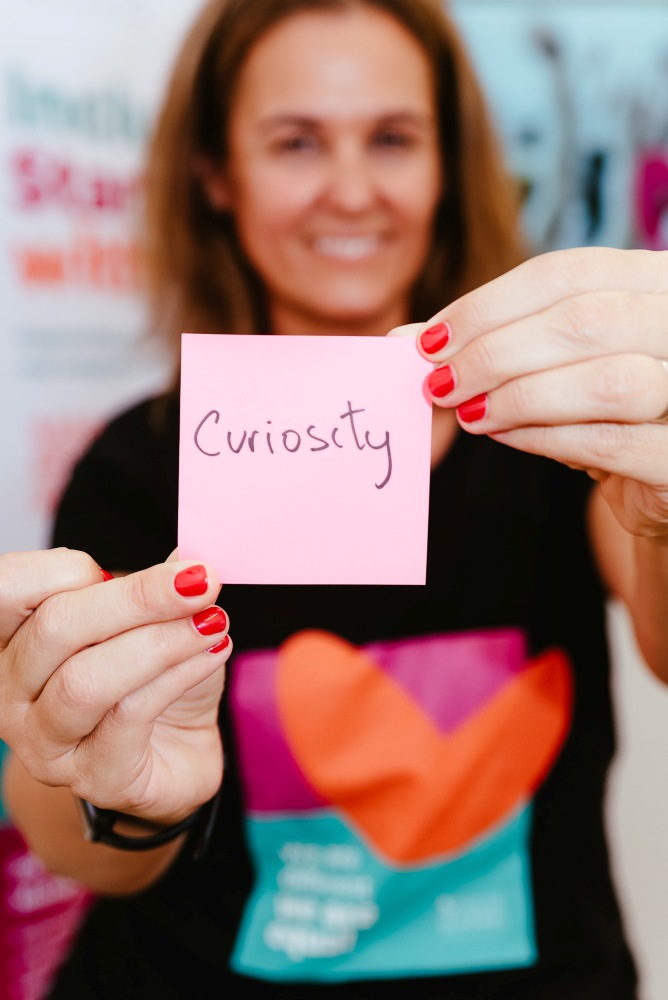 Brisbane Branding Photography holding sticky note saying curiosity